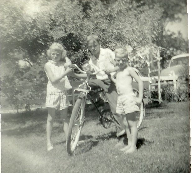 Dixie Mae Brewer's daughter Sharon Armstrong, Jerry Brewer and Kenny Brewer  Old house by the Railroad Track in Monette, AR